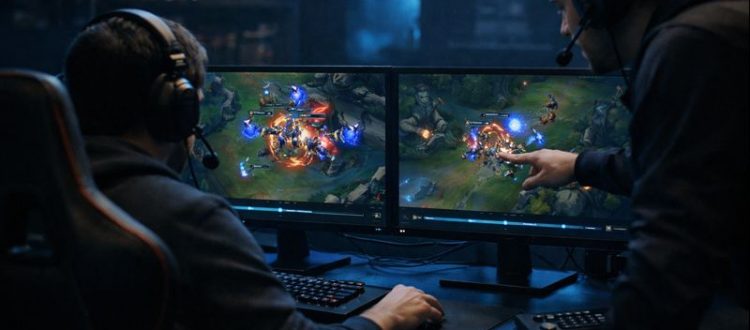 LoL player analyzing replay VOD on dual monitors for ranked improvement